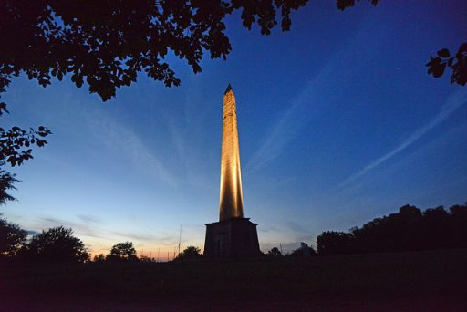 Wellington Monument at night lit up