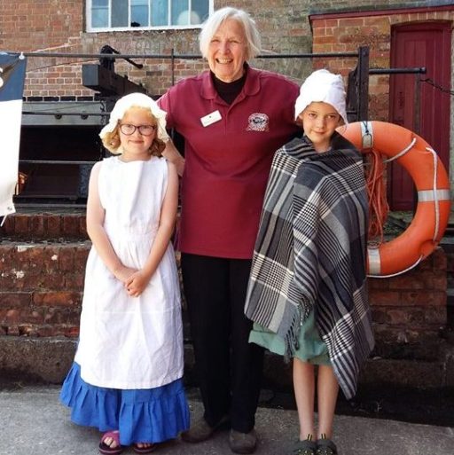 Coldharbour Mill steam day, woman stood with two children in fancy dress